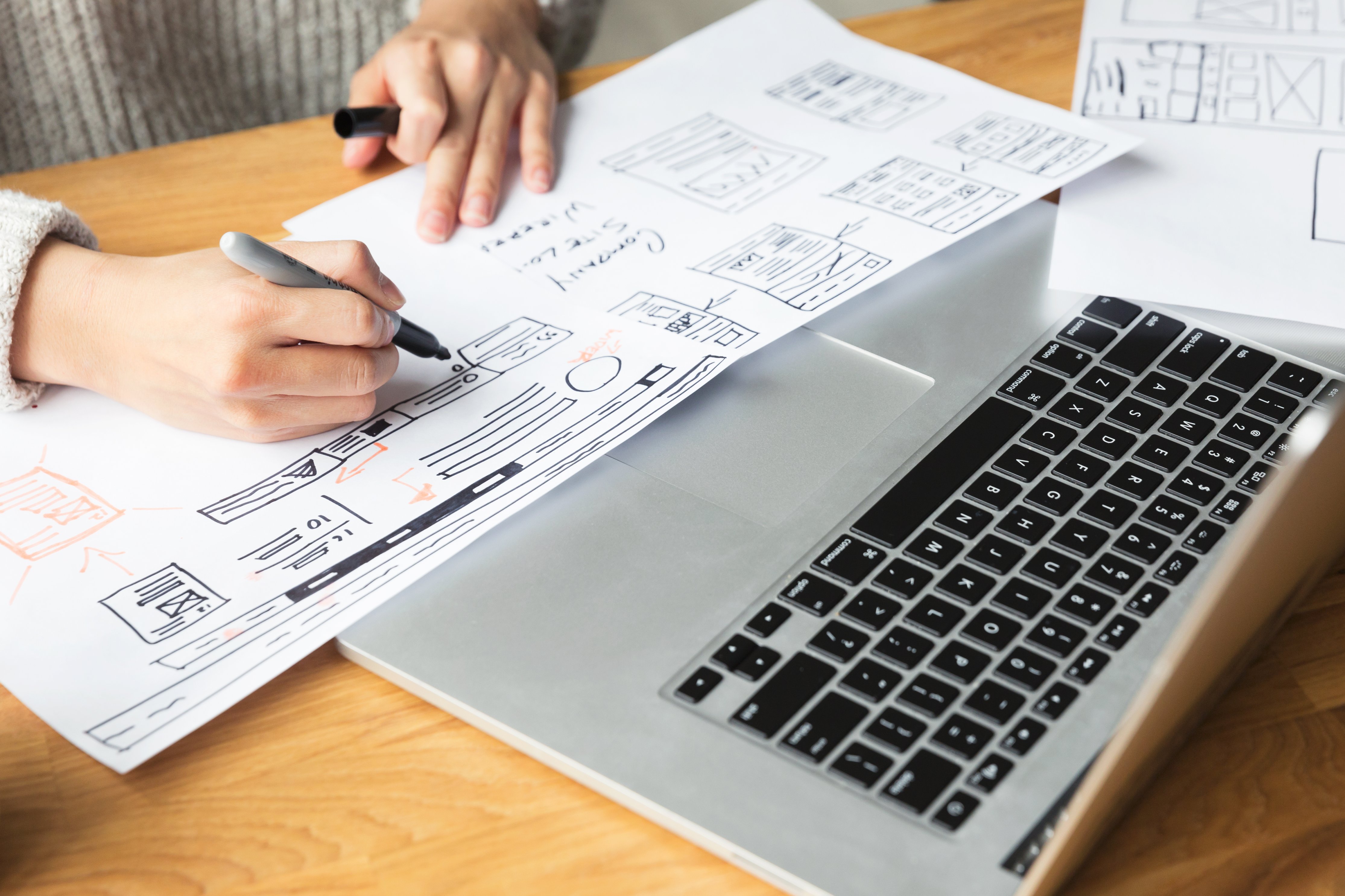 Designer drawing a website mockup