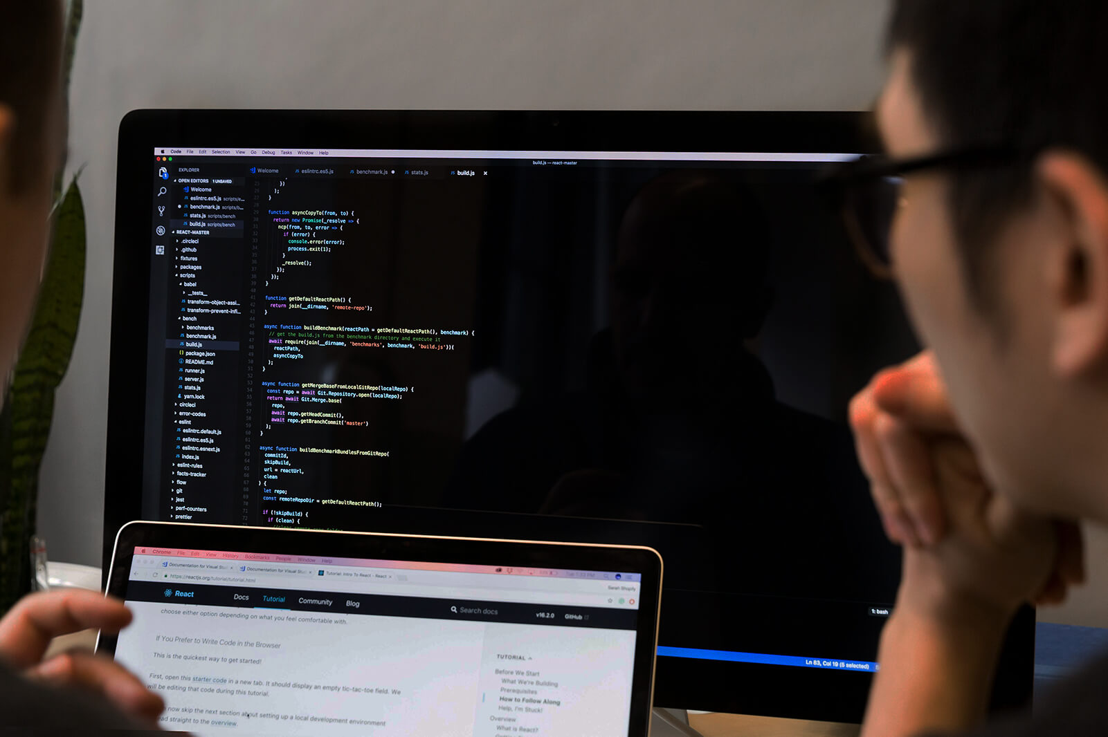 Developers reviewing React code