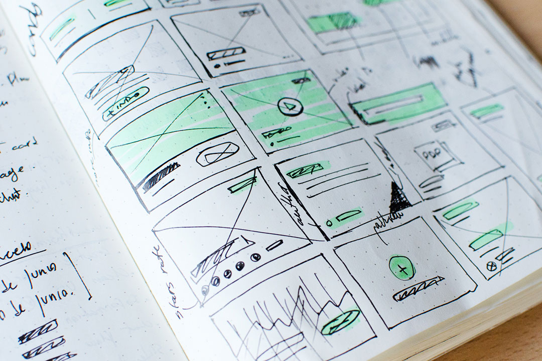 Handwritten wireframes in a notebook